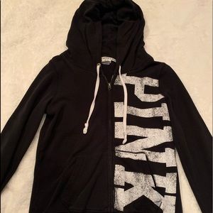 A black zip up hoodie from PINK
